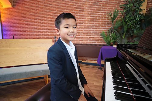 Pianist Darwin Chen at the piano before performing in the Junior and Intermediate Piano category of the Brandon Festival of the Arts at Knox United Church on March 3. (Tim Smith/The Brandon Sun)