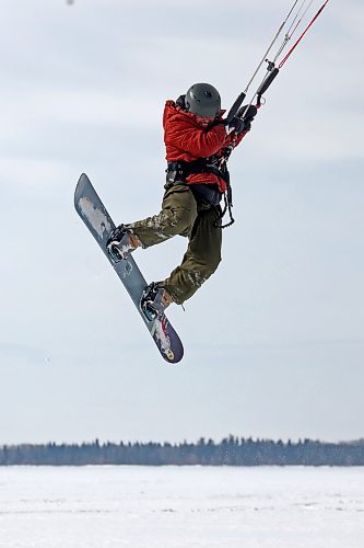 Ryan Murray of Onanole catches air while snowkiting at Clear Lake in Riding Mountain National Park on a windy Tuesday afternoon. Murray offers snowkiting lessons through the Friends of Riding Mountain National Park. Snowkiting is using a kite and the power of the wind to glide across snow and ice on a snowboard. (Tim Smith/The Brandon Sun)