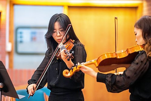 MIKAELA MACKENZIE / WINNIPEG FREE PRESS

Violinists Mini Jang (left) and Eun Shin Lee play in the Winnipeg Music Festival at Young United Church in Winnipeg on Friday, March 10, 2023. For &#x460;story.

Winnipeg Free Press 2023.