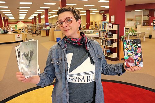 Programming and outreach assistant Michelle Boudreau showcases some of her favourite volumes of collected poetry at the Western Manitoba Regional Library's downtown Brandon branch Thursday afternoon. The WMRL is hosting a live poetry reading Tuesday night for World Poetry Day. (Kyle Darbyson/The Brandon Sun)