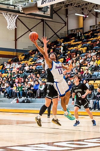 MIKAELA MACKENZIE / WINNIPEG FREE PRESS

Sturgeon Heights Husky Noah Kankam (13) jumps for the net in a game against the Vincent Massey Trojans in the boy's AAAA provincial semi-finals at Investors Group Athletic Centre in Winnipeg on Thursday, March 16, 2023. For Josh story.

Winnipeg Free Press 2023.