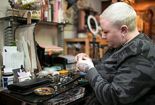 Delaney Tycholis, 29, who works in the restaurant industry and also runs a jewelry business under the brand Daisy Wild Vintage, is part of the millennials and generation Zs facing financial challenges these days. Tycholis is pictured working on jewerly at her home workshop. (Brook Jones / Winnipeg Free Press)