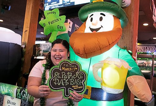 Kim Tan, who is the marketing director at the Thirsty Lion Tavern at 525 Dale Blvd., in Winnipeg, Man., shows her enthusiasm for the upcoming St. Patrick's Day bash, which gets underway at the local tavern at 7 p.m. March 17, 2023. (Brook Jones / Winnipeg Free Press)