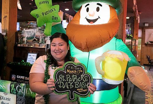 Kim Tan, who is the marketing director at the Thirsty Lion Tavern at 525 Dale Blvd., in Winnipeg, Man., shows her enthusiasm for the upcoming St. Patrick's Day bash, which gets underway at the local tavern at 7 p.m. March 17, 2023. (Brook Jones / Winnipeg Free Press)