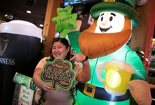 Kim Tan, who is the marketing director at the Thirsty Lion Tavern at 525 Dale Blvd., in Winnipeg, Man., shows her excitement for the St. Patrick's Day bash, which gets underway at the local tavern at 7 p.m. March 17, 2023. (Brook Jones / Winnipeg Free Press)