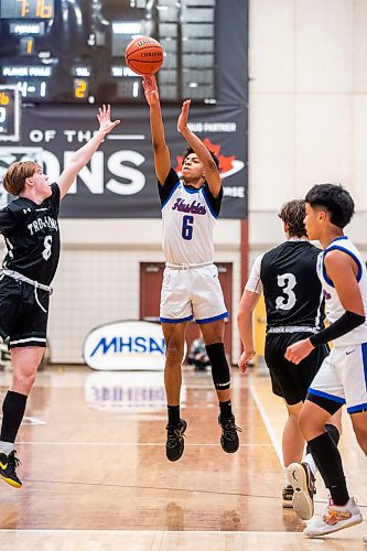 MIKAELA MACKENZIE / WINNIPEG FREE PRESS

Sturgeon Heights Husky Carlos Silva shoots for the net in a game against the Vincent Massey Trojans in the boy's AAAA provincial semi-finals at Investors Group Athletic Centre in Winnipeg on Thursday, March 16, 2023. For Josh story.

Winnipeg Free Press 2023.