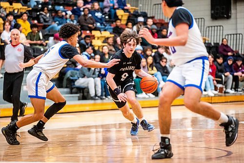 MIKAELA MACKENZIE / WINNIPEG FREE PRESS

Vincent Massey Trojan Lotachukwu Offor dribbles the ball in a game against the Sturgeon Heights Huskies in the boy's AAAA provincial semi-finals at Investors Group Athletic Centre in Winnipeg on Thursday, March 16, 2023. For Josh story.

Winnipeg Free Press 2023.