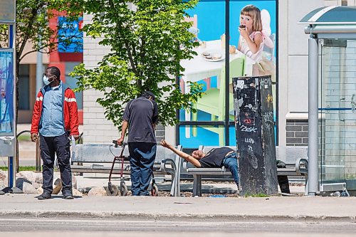 MIKE DEAL / WINNIPEG FREE PRESS
A houseless person lays down on the bench by the bus shelter at the corner of Regent Avenue West and Stapon Road.
During Thursday's council meeting, Transcona Councillor Shawn Nason will ask the Public Service to dismantle a pair of problem bus shelters located near Kildonan Place Mall. 
See Tyler Searle story
220607 - Tuesday, June 07, 2022.