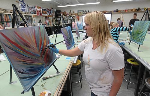 Brandon Sun Killarney Lakeside Christian School teacher Erin Neufeld expands her painting skills during a hands-on workshop. Over $12,000 was raised at the Lakeside Christian School’s annual fundraiser recently, which will help the school erase a major mortgage debt. (File)