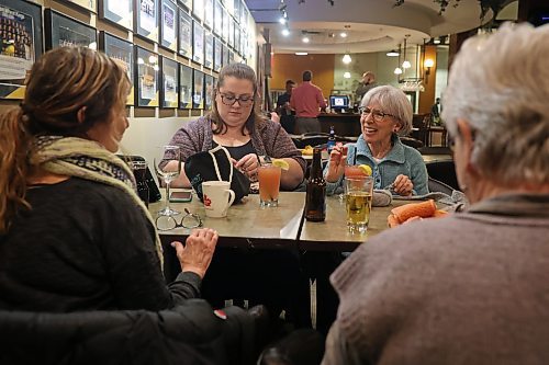 Judy Dandridge, Karlie Mymryk, Wendy Brownlie and Mona Koroscil trade stories while knitting at Tavern United in the Canad Inns Hotel in Brandon on Wednesday evening. (Tim Smith/The Brandon Sun)