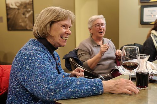 Karen Webb and Mona Koroscil laugh while knitting with friends at Tavern United in the Canad Inns Hotel in Brandon on Wednesday evening. (Tim Smith/The Brandon Sun)