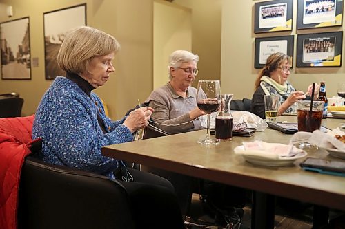 15032023
Karen Webb, Mona Koroscil and Judy Dandridge socialize while knitting with friends at Tavern United in the Canad Inns Hotel in Brandon on Wednesday evening. 
(Tim Smith/The Brandon Sun)