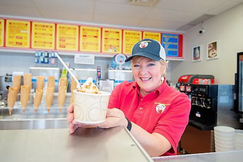 Mike Sudoma/Winnipeg Free Press
Lynn Dusessoy of Sargeant Sundae serves one of their first ice cream treats of the year Friday afternoon as the ice cream shop opens its once doors again after a cold winter off
March 17, 2023 