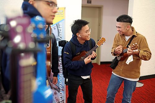 17032023
Julius Roces and Patrick Arnuco of Maples Collegiate laugh while trying out a pair of ukulele&#x2019;s together during the Brandon University Jazz Festival at the Western Manitoba Centennial Auditorium on Friday. The three day festival, the first since 2019 due to the COVID-19 pandemic, brought in school bands from across the province for performances and workshops throughout the WMCA and Brandon University.
(Tim Smith/The Brandon Sun)