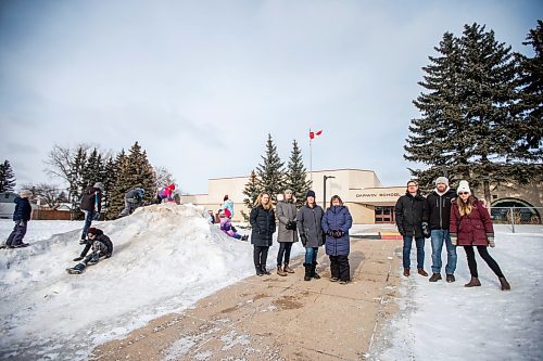 MIKAELA MACKENZIE / WINNIPEG FREE PRESS


Lindsey Kinsley (left), Susan Mortimer, Melissa Martin, Karen Helbig, Justin Stanus, Brett Meade, and Chantal Gendron, a group of parents upset about proposal to turn Darwin School (currently kindergarten to grade eight) into only a grade five to eight school, pose for a photo in front of the school as their kids play beside in Winnipeg on Friday, March 17, 2023. For &#x460;story.

Winnipeg Free Press 2023.