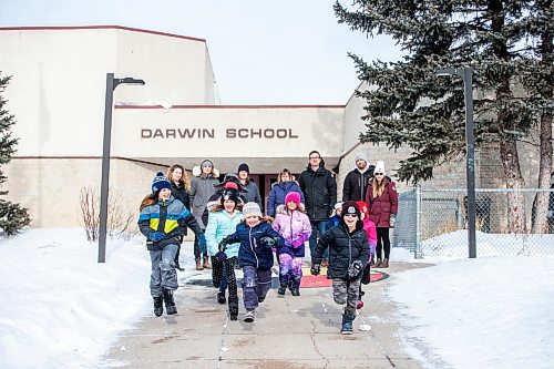 MIKAELA MACKENZIE / WINNIPEG FREE PRESS


Lindsey Kinsley (left), Susan Mortimer, Melissa Martin, Karen Helbig, Justin Stanus, Brett Meade, and Chantal Gendron, a group of parents upset about proposal to turn Darwin School (currently kindergarten to grade eight) into only a grade five to eight school, pose for a photo in front of the school as their kids, Clark Martin (13, left), Stella Martin (nine), Audrey Martin (seven), Lexie Helbig, and Brayden Meade run towards the camera in Winnipeg on Friday, March 17, 2023. For &#x460;story.

Winnipeg Free Press 2023.