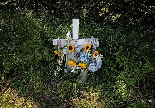 JESSICA LEE / WINNIPEG FREE PRESS

A memorial to Mark Lugli and his son Jacob Lugli is photographed August 4, 2022 at the Barren Lake and Trans Canada Hwy intersection near Ontario. In 2019, Mark Lugli and his son Jacob Lugli were tragically killed at this intersection when an eastbound transport truck plowed into Mark&#x2019;s westbound truck. There was stopped traffic trying to turn left and the transport driver was trying to avoid the stopped traffic and drove into the westbound lane.

Reporter: Chris Kitching
