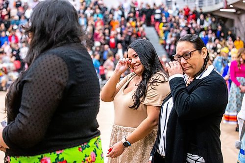 MIKAELA MACKENZIE / WINNIPEG FREE PRESS

Arts graduates Jorden Smith (left) and Cara Velnes get emotional during the grand entrance at the U of W graduation Pow Wow at the Duckworth Centre in Winnipeg on Saturday, March 18, 2023. For Tyler story.

Winnipeg Free Press 2023.