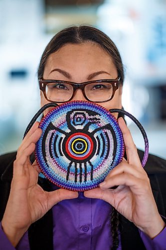 MIKE DEAL / WINNIPEG FREE PRESS
Rosanna Deerchild holds up a beaded medallion depicting the crow spirit which makes an appearance in her play.
Rosanna Deerchild's play The Secret to Good Tea begins its run at MTC on March 22. The story of a daughter and mother begins as a typical family drama, but eventually, the pair begins to confront the past, including the mother's painful memories of residential school. 
See Ben Waldman story 
230320 - Monday, March 20, 2023.