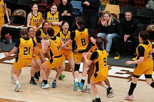 JOHN WOODS / WINNIPEG FREE PRESS
The Dakota Lancers celebrate a win over the Garden City Gophers in the Manitoba High School 2023 AAAA Provincial Basketball Championship at the University of Manitoba Monday, March 20, 2023. 