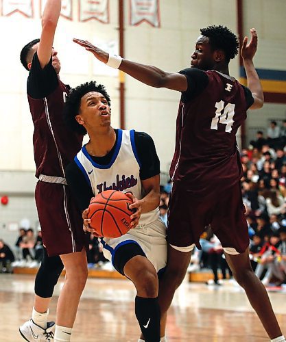 JOHN WOODS / WINNIPEG FREE PRESS
St Paul&#x2019;s Crusaders&#x2019; Mohammed Zeid (8) and Ramogy Nyagudi (14) defend against Sturgeon Heights Huskies&#x2019; Noah Kankam (13) in the Manitoba High School 2023 AAAA Provincial Basketball Championship at the University of Manitoba Monday, March 20, 2023. 