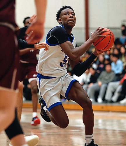 JOHN WOODS / WINNIPEG FREE PRESS
Sturgeon Heights Huskies&#x2019; Samuel Sola (5) drives for the net against St Paul&#x2019;s Crusaders in the Manitoba High School 2023 AAAA Provincial Basketball Championship at the University of Manitoba Monday, March 20, 2023. 