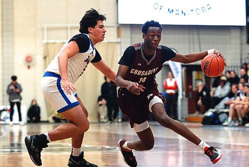 JOHN WOODS / WINNIPEG FREE PRESS
Sturgeon Heights Huskies&#x2019; Luciano Glades (10) defends against St Paul&#x2019;s Crusaders&#x2019; Ramogy Nyagudi (14) in the Manitoba High School 2023 AAAA Provincial Basketball Championship at the University of Manitoba Monday, March 20, 2023. 