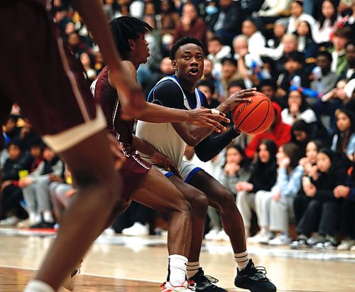 JOHN WOODS / WINNIPEG FREE PRESS
St Paul&#x2019;s Crusaders&#x2019; Giovanni Ajiamah (10) defends against Sturgeon Heights Huskies&#x2019; Samuel Sola (5) in the Manitoba High School 2023 AAAA Provincial Basketball Championship at the University of Manitoba Monday, March 20, 2023. 