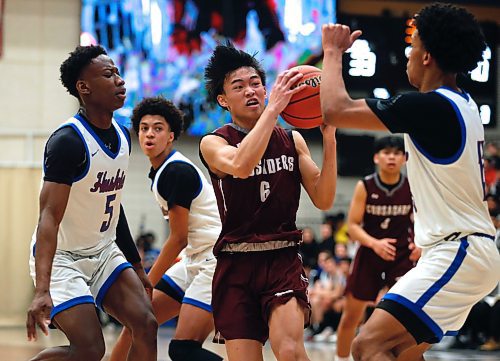 JOHN WOODS / WINNIPEG FREE PRESS
Sturgeon Heights Huskies&#x2019; Samuel Sola (5) and Noah Kankam (13) defend against St Paul&#x2019;s Crusaders&#x2019; Juan Guaring (6) in the Manitoba High School 2023 AAAA Provincial Basketball Championship at the University of Manitoba Monday, March 20, 2023. 