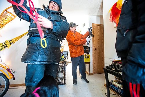 MIKAELA MACKENZIE / WINNIPEG FREE PRESS

Sidney Klassen, PE teacher and dog sled program founder, and Gabriel Hall, expert musher who now works with Spirit North, show grade nine student Internal Hansen how to put an x-back harness onto a dog at Sidney&#x573; house on Bloodvein First Nation on Wednesday, March 8, 2023. For Maggie Macintosh story.

Winnipeg Free Press 2023.