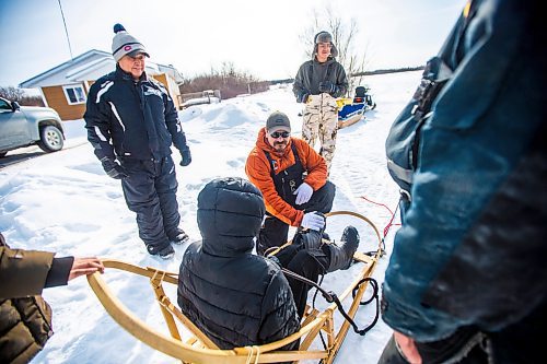 MIKAELA MACKENZIE / WINNIPEG FREE PRESS


Gabriel Hall gives grade eight student Harveil Cook some tips as William Young (left) and Jackson Hall also help out before heading out for a sled dog ride with the school program on Bloodvein First Nation on Wednesday, March 8, 2023. For Maggie Macintosh story.

Winnipeg Free Press 2023.