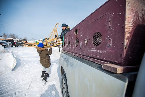 MIKAELA MACKENZIE / WINNIPEG FREE PRESS

Grade five student Trudy Duck helps PE teacher Sidney Klassen unload the sled before heading out for a sled dog ride with the school program on Bloodvein First Nation on Wednesday, March 8, 2023. For Maggie Macintosh story.

Winnipeg Free Press 2023.