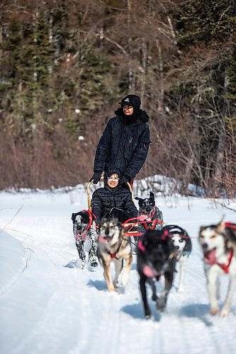 MIKAELA MACKENZIE / WINNIPEG FREE PRESS

Internal Hansen, grade nine student, mushes with Harveil Cook, grade eight student, in the sled on a dog sled ride on Bloodvein First Nation on Wednesday, March 8, 2023. For Maggie Macintosh story.

Winnipeg Free Press 2023.