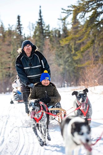 MIKAELA MACKENZIE / WINNIPEG FREE PRESS

Grade five student Trudy Cook smiles as PE teacher and dog sled program founder Sidney Klassen takes her on a dog sled ride on Bloodvein First Nation on Wednesday, March 8, 2023. For Maggie Macintosh story.

Winnipeg Free Press 2023.