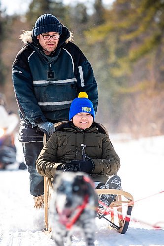 MIKAELA MACKENZIE / WINNIPEG FREE PRESS

Grade five student Trudy Cook smiles as PE teacher and dog sled program founder Sidney Klassen takes her on a dog sled ride on Bloodvein First Nation on Wednesday, March 8, 2023. For Maggie Macintosh story.

Winnipeg Free Press 2023.