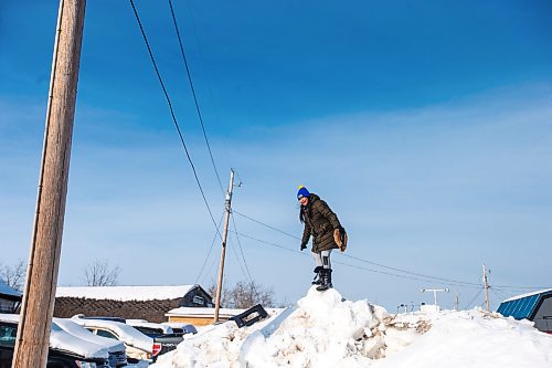 MIKAELA MACKENZIE / WINNIPEG FREE PRESS

Grade five student Trudy Duck plays on a heap of snow after going on a sled dog ride with the school program on Bloodvein First Nation on Wednesday, March 8, 2023. For Maggie Macintosh story.

Winnipeg Free Press 2023.