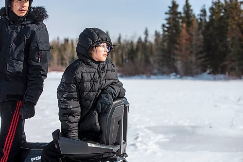 MIKAELA MACKENZIE / WINNIPEG FREE PRESS

Grade nine student Internal Hansen (left) and grade eight student Harveil Cook watch from a snowmobile as other students also get sled rides on Bloodvein First Nation on Wednesday, March 8, 2023. For Maggie Macintosh story.

Winnipeg Free Press 2023.