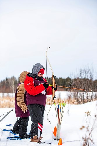 MIKAELA MACKENZIE / WINNIPEG FREE PRESS

Hughie Goosehead loads an arrow in the archery portion of the snowshoe races (a land-based part of the winter carnival festivities at Bloodvein River School) on Bloodvein First Nation on Thursday, March 9, 2023. For Maggie Macintosh story.

Winnipeg Free Press 2023.