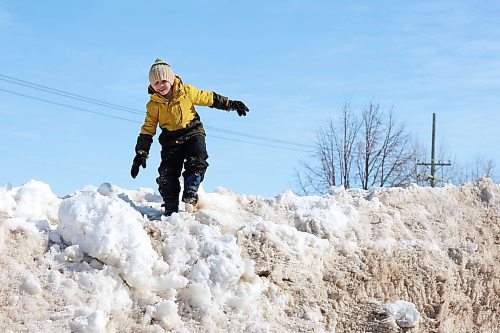 21032023
Ezra Strilchuk plays on a snowbank in Dauphin on a mild and sunny Tuesday afternoon.
(Tim Smith/The Brandon Sun)