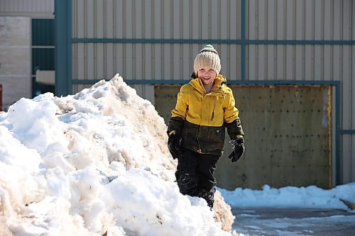 21032023
Ezra Strilchuk plays on a snowbank in Dauphin on a mild and sunny Tuesday afternoon.
(Tim Smith/The Brandon Sun)