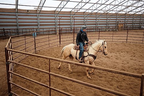 21032023
Adrian McKerchar with Elkhorn Riding Adventures works with a clients horse in a ring at the stable on Tuesday afternoon.
(Tim Smith/The Brandon Sun)