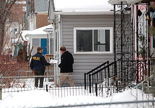 JOHN WOODS / WINNIPEG FREE PRESS
Police investigate on Langside where a shooting occurred. Bullet holes mark 571 Langside which was shot at earlier on Tuesday, March 21, 2023. 

Re: Searle
