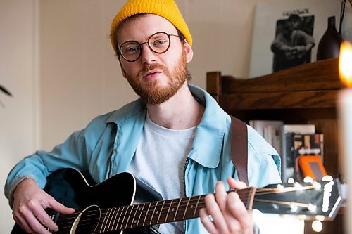 MIKAELA MACKENZIE / WINNIPEG FREE PRESS

Dylan MacDonald, a singer-songwriter who is releasing his album (Field Guide) tomorrow, poses for a portrait in his home in Winnipeg on Thursday, Oct. 27, 2022. For Ben Waldman story.
Winnipeg Free Press 2022.