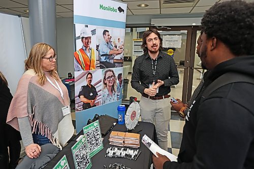 Shelley Kyle and Brett Howden with the Province of Manitoba Public Service Commission talk to Brandon University students during the Summer Job Fair 2023 in the Knowles Douglas Student Union Centre on Wednesday. (Tim Smith/The Brandon Sun)