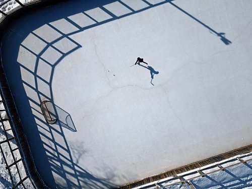 Andre Pashe casts a shadow as he practices his shots on net at the Central Community Club rink on a sunny Wednesday afternoon. (Tim Smith/The Brandon Sun)default