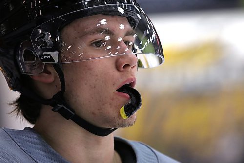 Brandon Wheat Kings winger Caleb Hadland chews on his mouth guard as he watches a drill on Thursday. (Perry Bergson/The Brandon Sun)