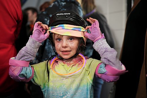 Five-year-old Brielle Reykdal waits in line in a stylish and colourful outfit for the opening of Roller Disco at the Sportsplex Arena on Thursday evening. The Wheat City Roller Derby League was on hand to rent skates to roller-skaters without their own pair. Dozens of roller-skating enthusiasts were already in line before the event started and spent the evening skating to music under the colourful lights and disco ball. (Tim Smith/The Brandon Sun)