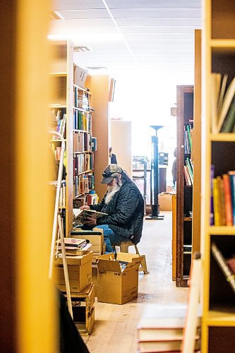 MIKAELA MACKENZIE / WINNIPEG FREE PRESS

Kevin Martin browses through horse books for his partner at Nerman&#x573; Books and Collectibles, which is closing down this Saturday after 30 years, in Winnipeg on Thursday, March 23, 2023. For Ben Waldman story.

Winnipeg Free Press 2023.