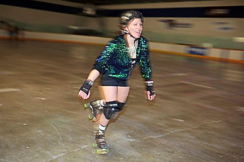 23032023
Sarah Jane Maynard smiles as she roller-skates during Roller Disco at the Sportsplex Arena on Thursday evening. The Wheat City Roller derby League was on hand to rent skates to interested roller-skaters without their own pair. Dozens of roller-skating enthusiasts were already in line before the event started and spent the event skating to music under the colourful lights and disco ball. 
(Tim Smith/The Brandon Sun)