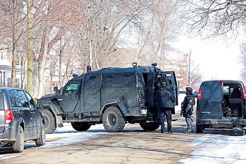 Members of the Brandon Police Service execute a warrant at a home in the 300 block of 11th Street in Brandon on Thursday. (Tim Smith/The Brandon Sun)